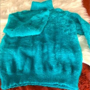 The softest sweater ever. Never worn. Too small